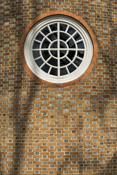 Vintage Round Window On A Brick Wall