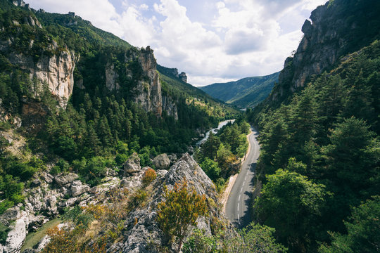 Winding road through a scenic green valley in the south of France