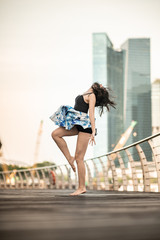 Beautiful Young Girl Dancing in the City