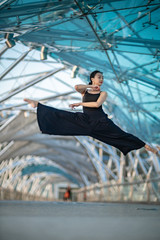 Beautiful Young Girl Dancing on a bridge