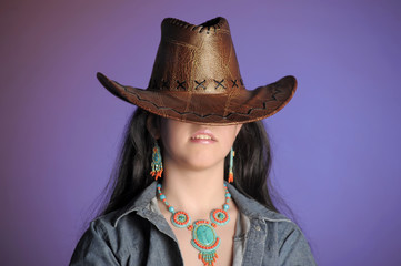 portrait of a brunette in a cowboy hat