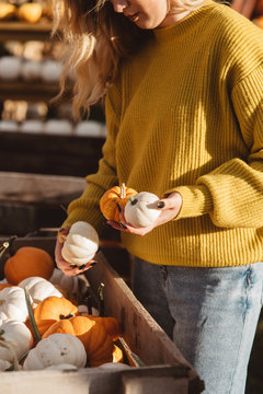 A young woman at a pumpkin patch