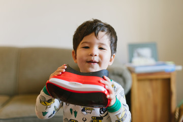 Happy kid with virtual reality headset at home