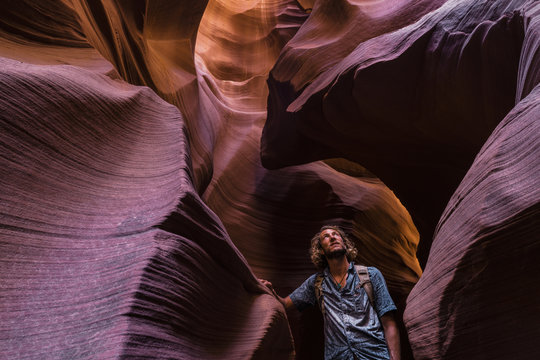 A young man admiring a slot canyon in Arizona