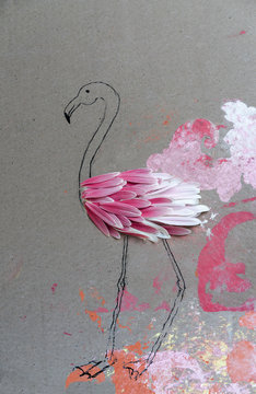 Flamingo made of flower petals on painted cardboard