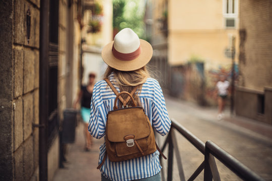 Woman doing tourism with map at Granada, Spain.