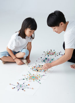 Mandala pattern with crystal and Asian women with her child