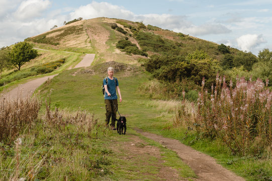 Man walking his dog across the Malvern Hills
