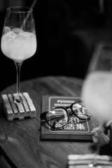 two Cocktails with glasses and Russian-Japanese Phrase Book in monochrome, selective focus