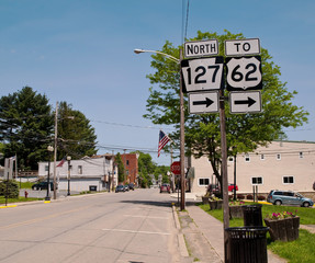 Tidioute, Pennsylvania, USA 5-23-2018 Main at Buckingham Streets showing signs for State Routes 127...