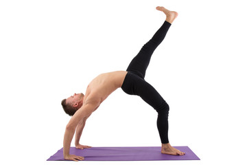 Yoga and a healthy lifestyle. Sexy man. White background. 