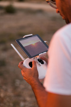Man flying drone at mountains