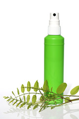 Herbal natural cosmetics with herb extract .Cosmetics in a green bottle  and green branch on a white background. Organic Natural Cosmetics Concept