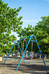 Swing chairs for children in park.