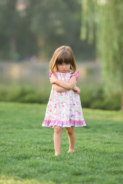Portrait of miffed cute girl looking at camera