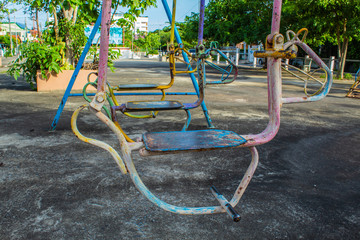 Swing chairs for children in park.