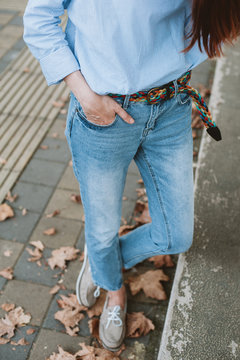 Woman wearing blue jeans and shirt