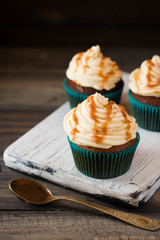 Caramel cupcakes on a dark background