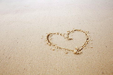 hearts drawn in beach.honeymoon or valentine's day concept