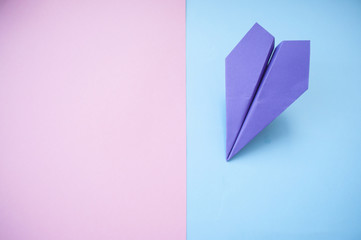 Paper plane on colorful background.
