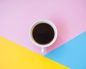 Obraz na płótnie Canvas A cup of coffee on colorful background.