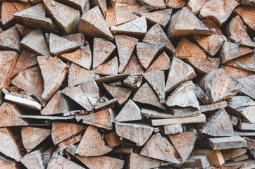 Stacked firewood texture. Toned image