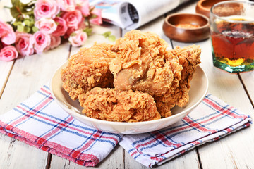 Crispy fried chicken on wooden table