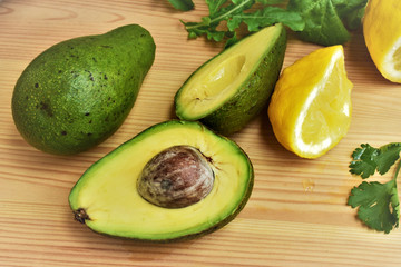 Avocado fresh, cut into half, sprinkled with lemon juice. 