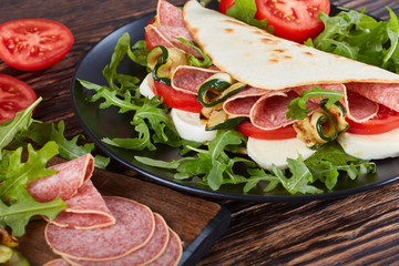 open sandwich - italian piadina with salami
