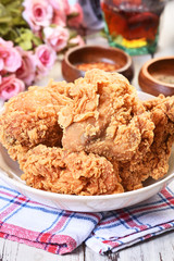 Crispy fried chicken on wooden table