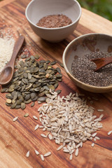 mixed seeds on wooden background