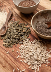 mixed seeds on wooden background
