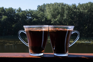 Two cups of coffee on the terrace in the open air