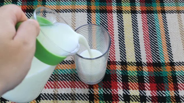Poring ayran in a glass
