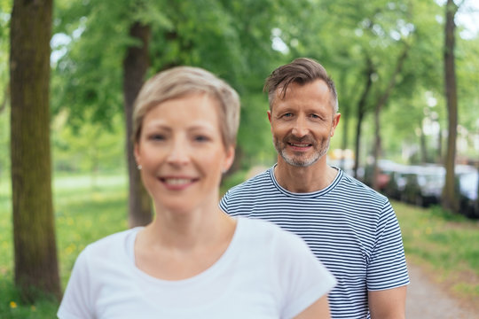 Mature couple enjoying a walk through a park