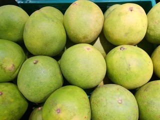 Top view of pomelo fruit  as a background on market stand in Thailand. (Citrus maxima (Burm.) Merr.)