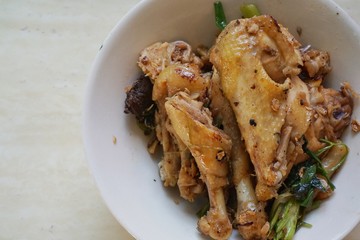 Chinese food, boiled chicken meat in white bowl on wooden table. Top view, Chinese cuisine, asian food, chinese new year food, steamed
