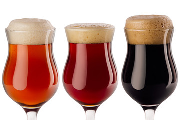 Beers collection poured in wineglasses closeup with foam - lager, red ale, porter -  isolated on white background.