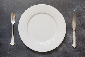 Table place setting on gray. Top view. Concept. Minimalism