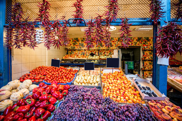 Counter filled with various vegetables and fruits in the great market hall in Budapest
