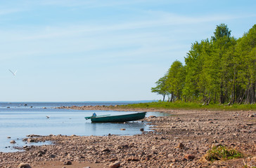 Naklejka na ściany i meble Powerboat on the bank of The Gulf of Finland