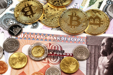 Colorful Egyptian currency and bank notes shot close up with golden bitcoins