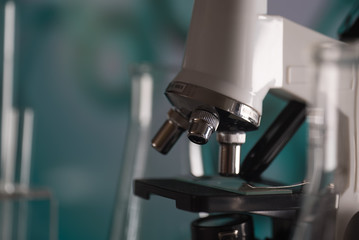 Science laboratory research and development concept. microscope with test tubes