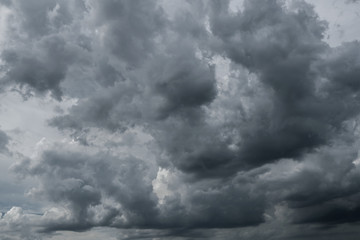 Obraz premium Dark storm clouds before rain used for climate background. Clouds become dark gray before raining. Dramatic background.