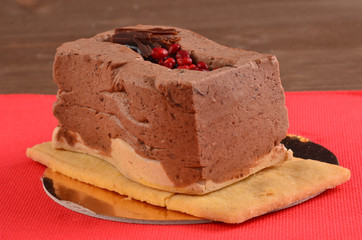 Caramel cake, mousse dessert on a plate.