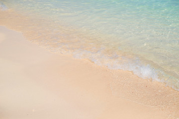Fototapeta na wymiar Soft wave of the sea on sandy beach.