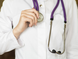 female doctor holding stethoscope isolated. close up view