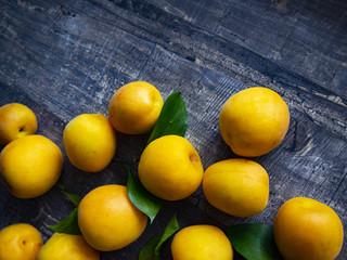 ripe juicy apricots on a wooden table