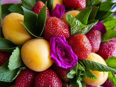 composition of ripe fruit, strawberry and rose