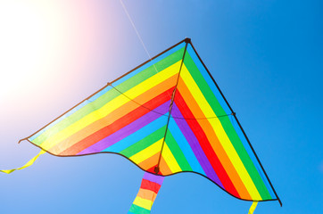 colorful flying kite game flying in the sky, the sun